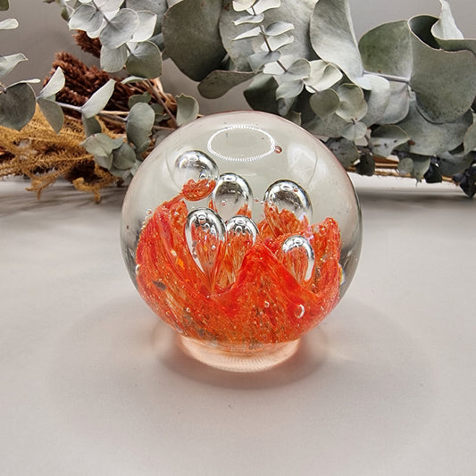 Vintage orange controlled bubble glass paperweight