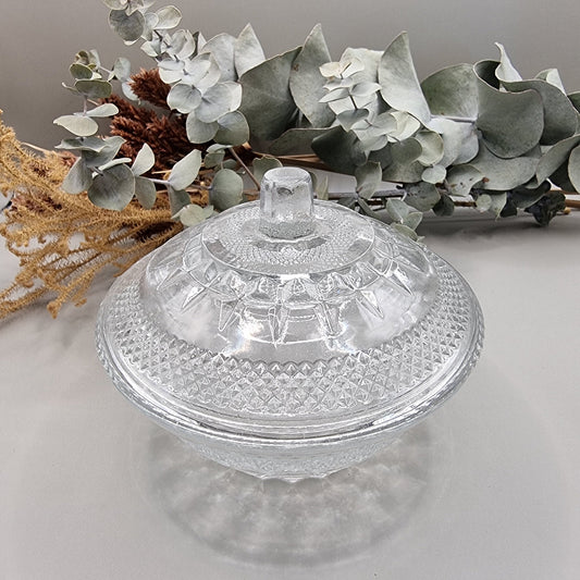 Vintage cut clear glass candy dish with lid and diamond pattern.