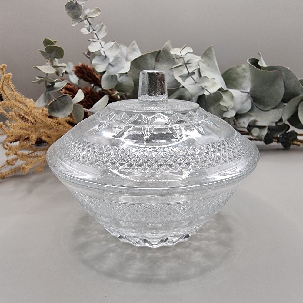 Vintage cut clear glass candy dish with lid and diamond pattern.
