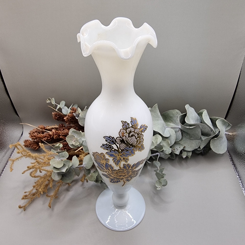 Tall white milk glass vase with gold and blue floral detail and ruffled top