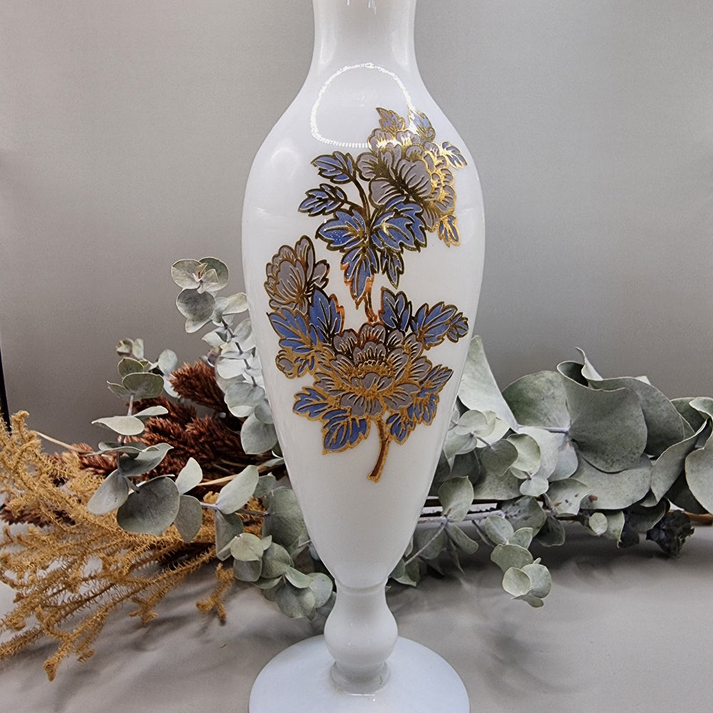 Tall white milk glass vase with gold and blue floral detail and ruffled top