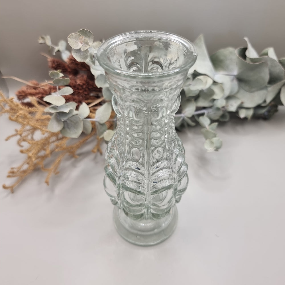 Clear vintage pressed glass vase with ornate baroque-style pattern