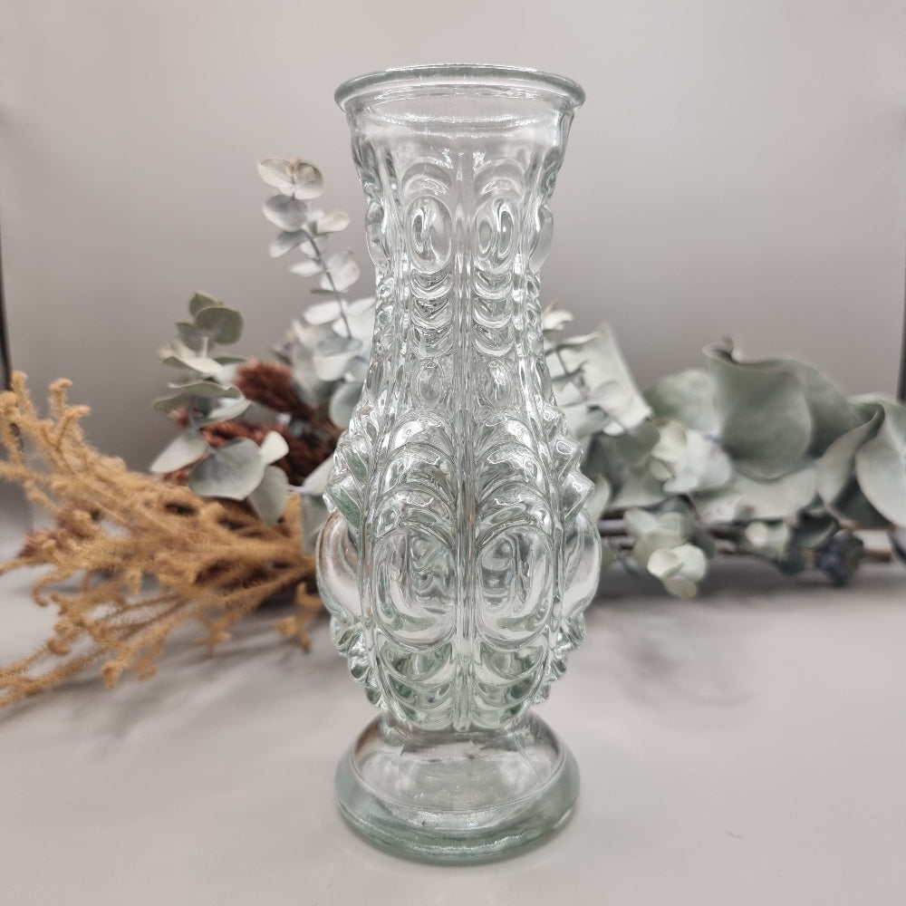 Clear vintage pressed glass vase with ornate baroque-style pattern