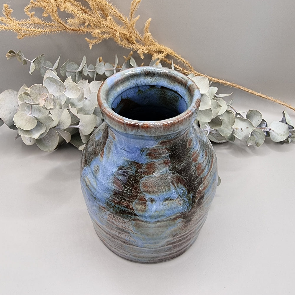 Handmade pottery vase with blue and brown glaze