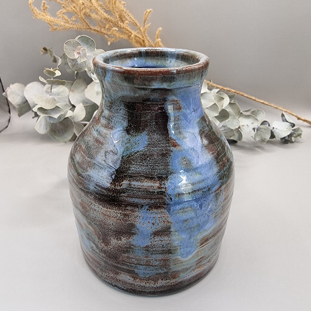 Handmade pottery vase with blue and brown glaze