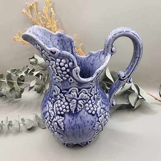 Blue pitcher with raised grape pattern