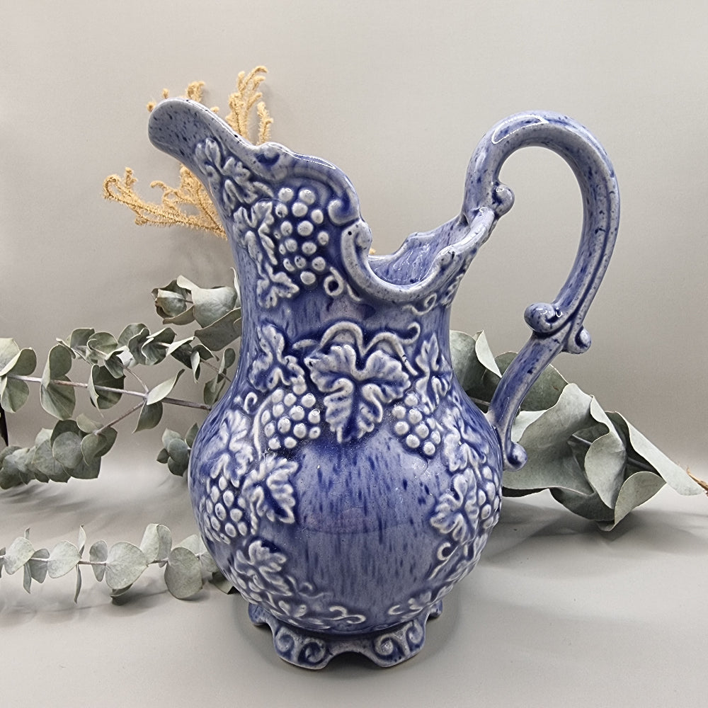Blue pitcher with raised grape pattern