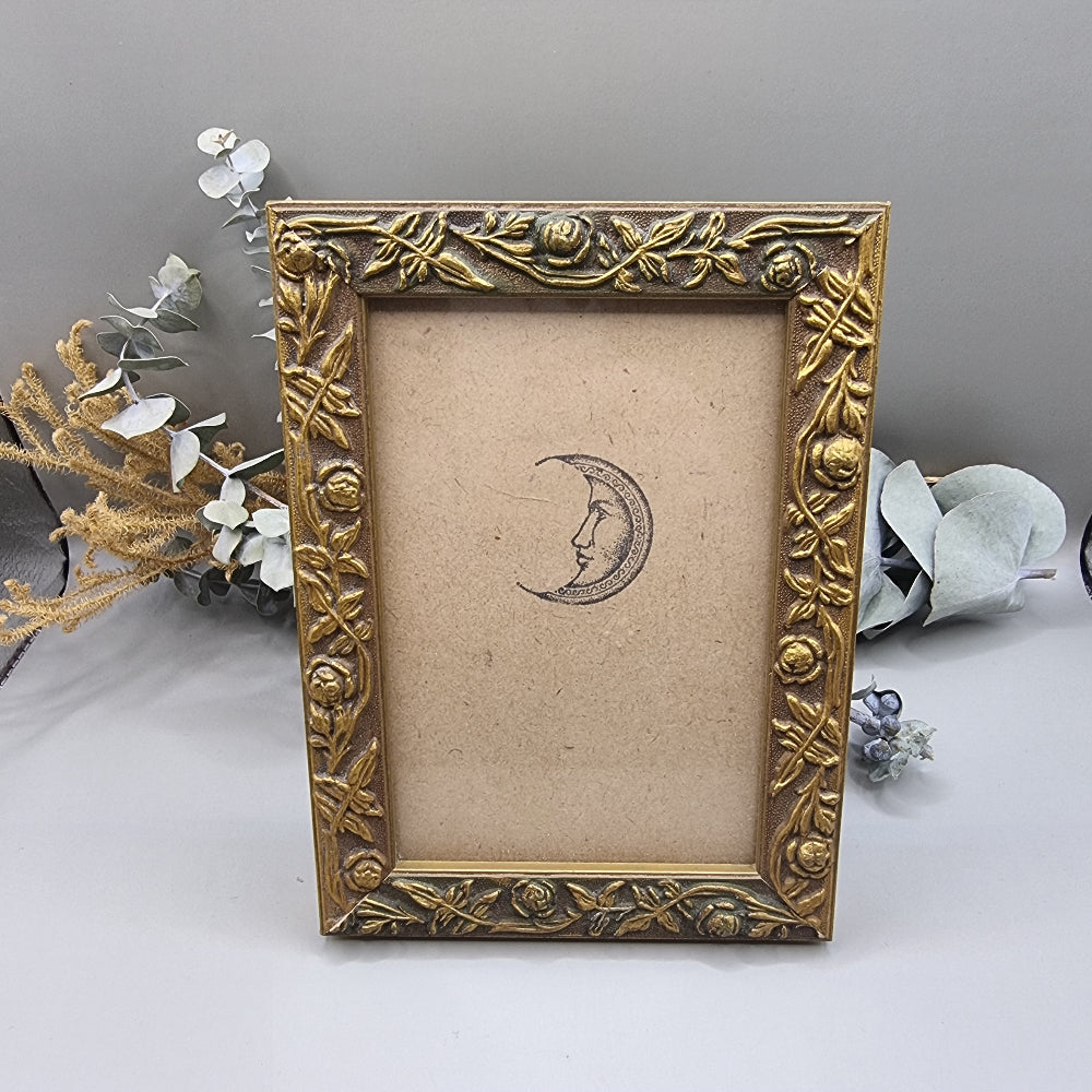 Vintage gold frame with rose pattern