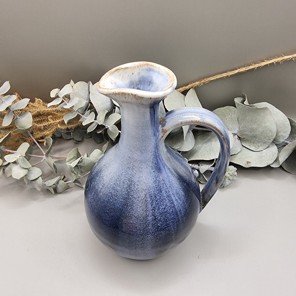 Pottery pitcher or vase with blue glaze