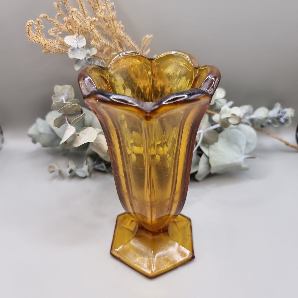 Amber glass with fluted body, scalloped rim and hex base—use as a vase or dessert glass.