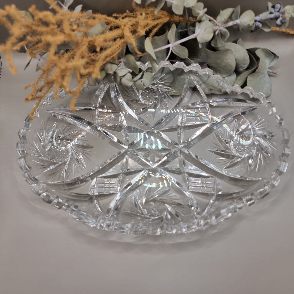 Oval cut glass tray with scalloped edge and intricate pressed pattern