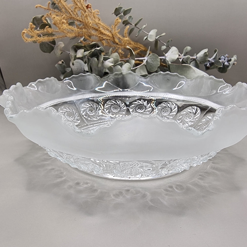 Pressed glass bowl with frosted scalloped edge and swirl design centre