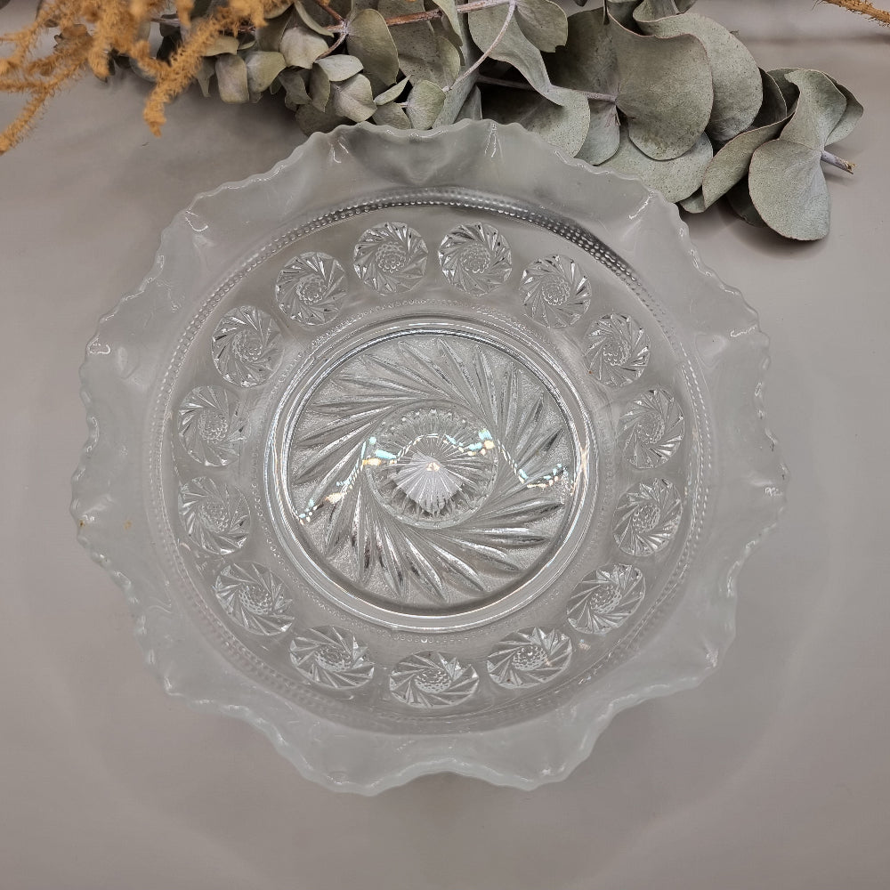 Pressed glass bowl with frosted scalloped edge and swirl design centre