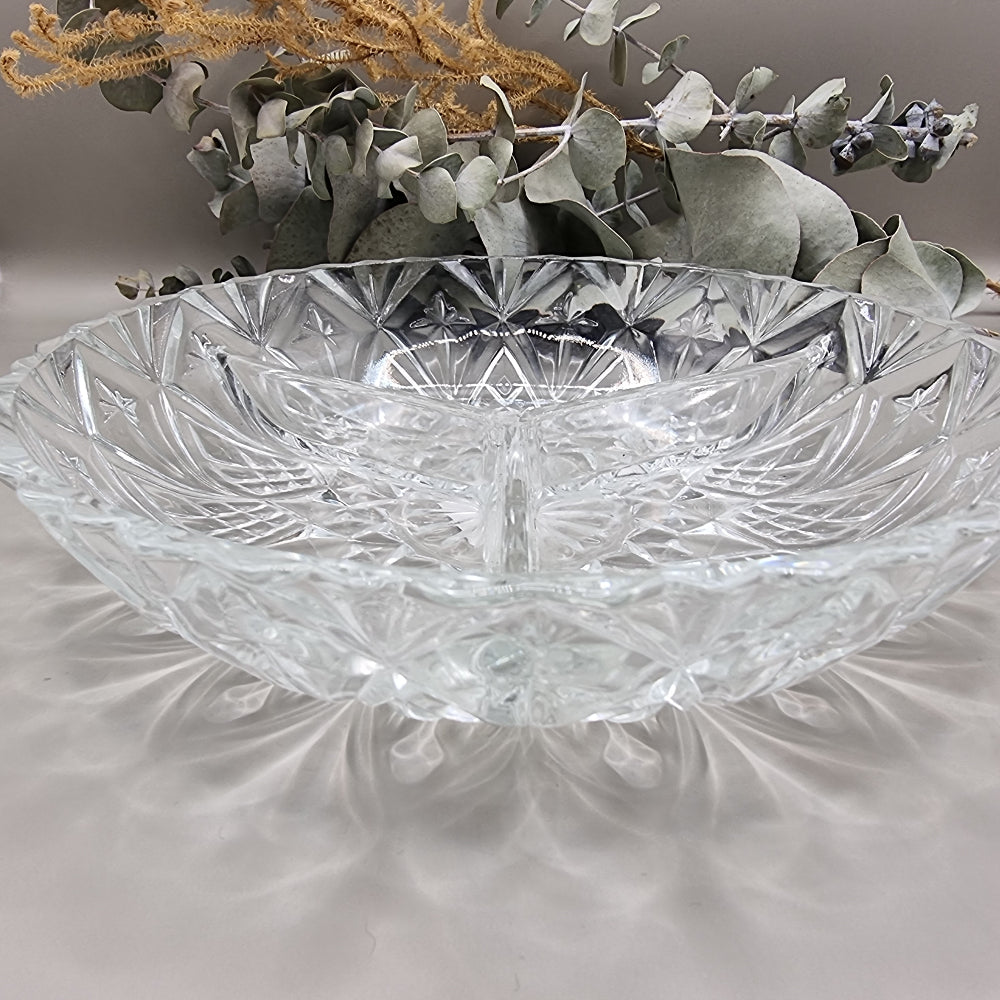 Three-section pressed glass dish with starburst and diamond pattern