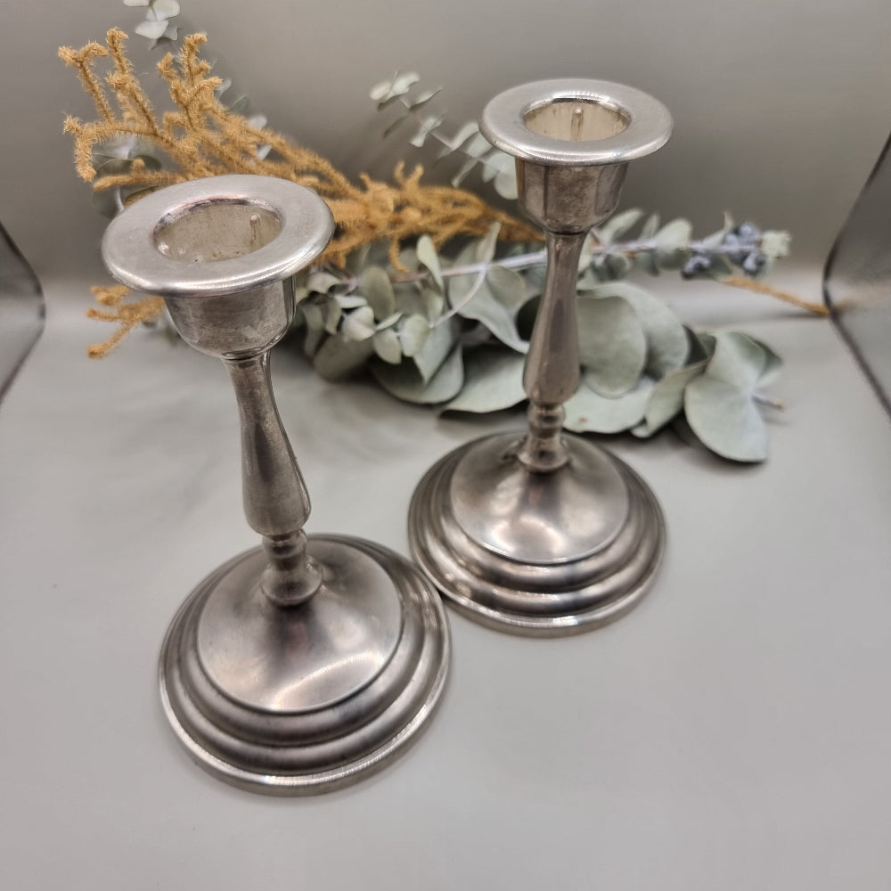 Pair of tall vintage silver candle holders with tapered stems