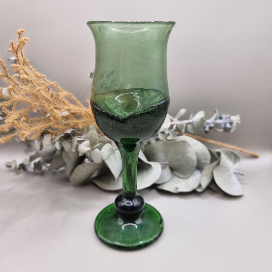 Vintage dark green handblown wine glass with flared rim and bubbled texture