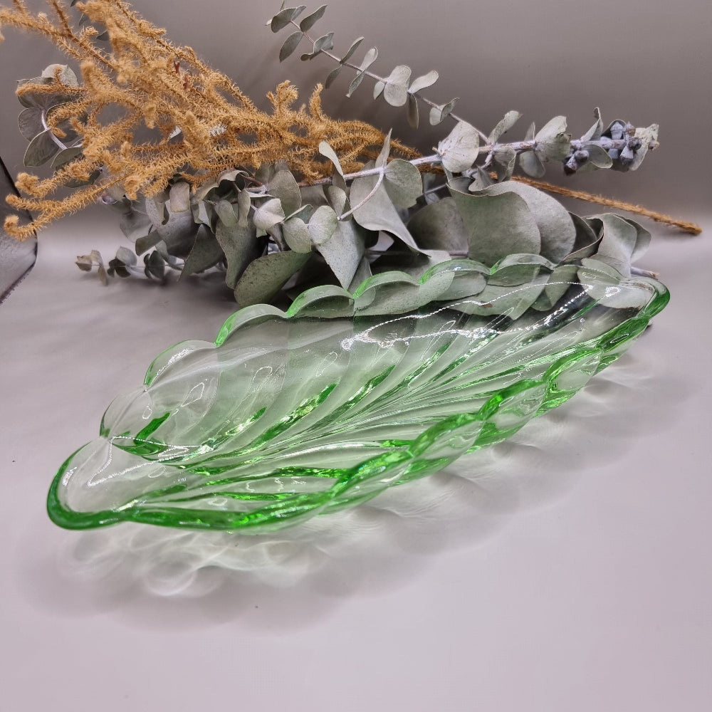 Vintage green glass leaf-shaped dish with scalloped edge