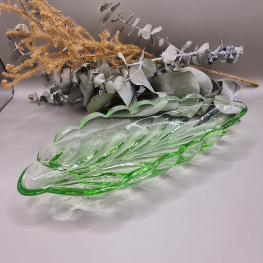 Vintage green glass leaf-shaped dish with scalloped edge