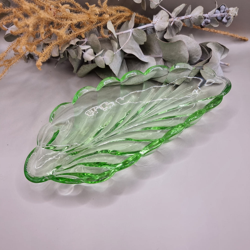 Vintage green glass leaf-shaped dish with scalloped edge