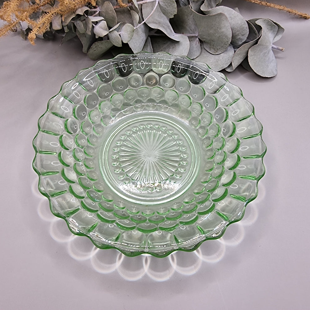 Vintage green pressed glass scalloped dish with sunburst and dot pattern