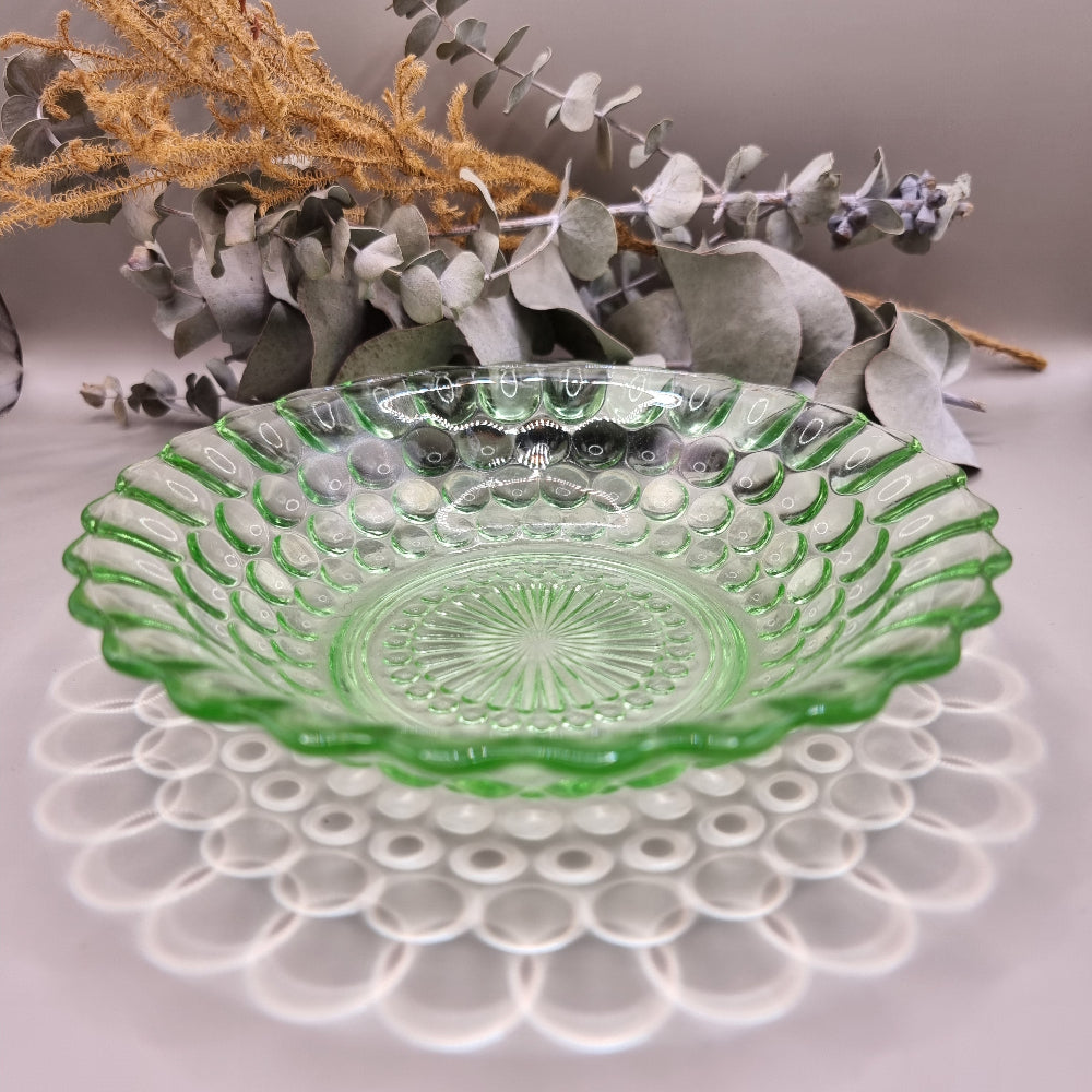 Vintage green pressed glass scalloped dish with sunburst and dot pattern