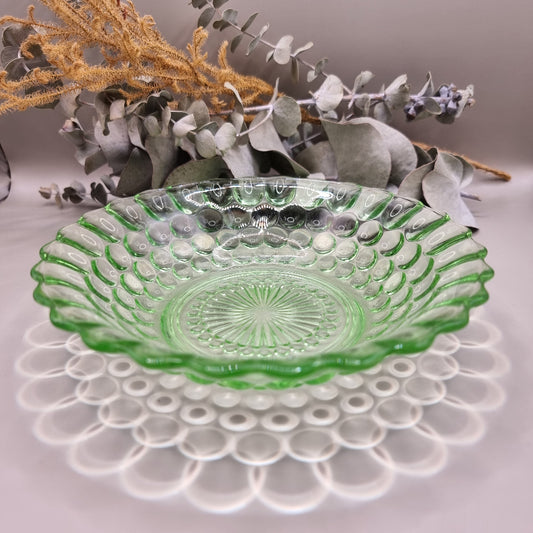 Vintage green pressed glass scalloped dish with sunburst and dot pattern