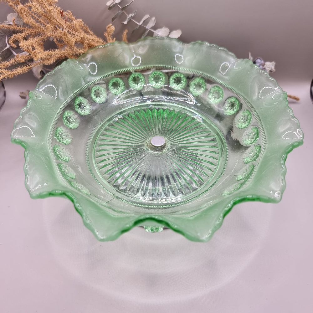 Vintage green glass pedestal bowl with scalloped rim and pressed design