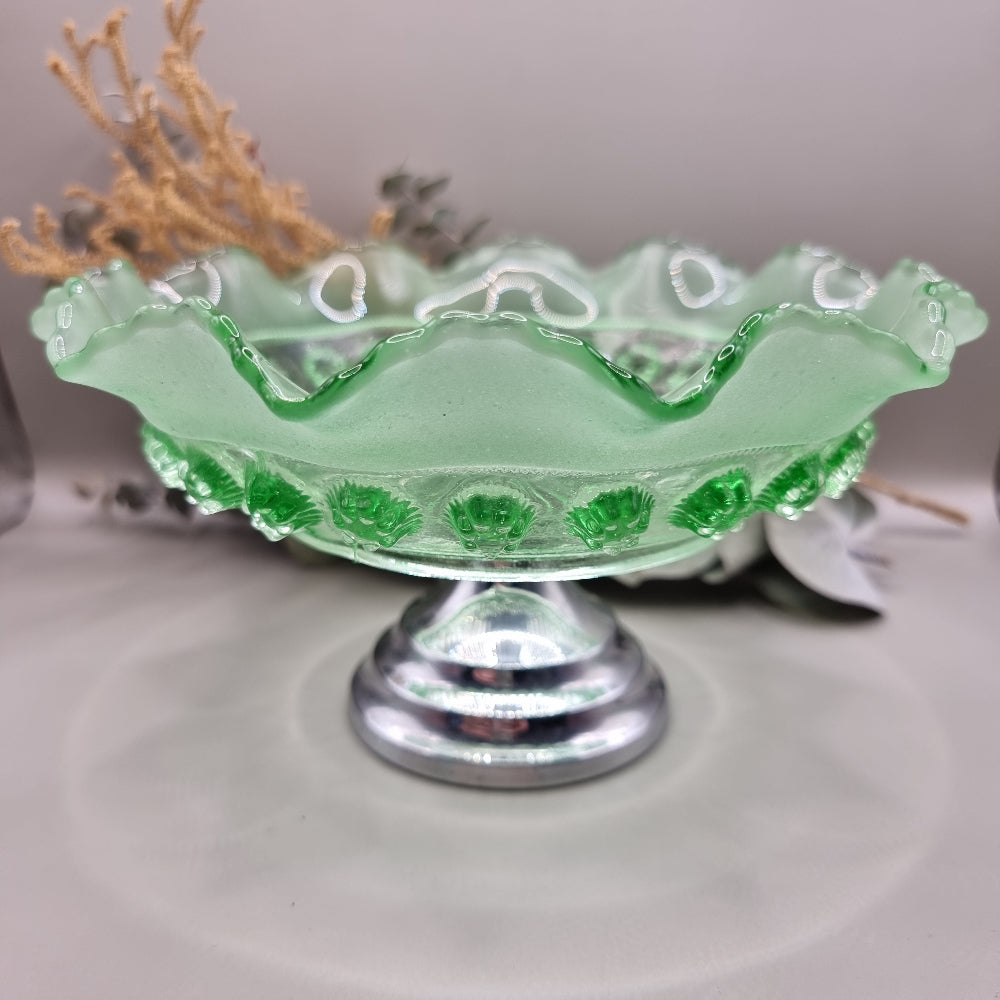 Vintage green glass pedestal bowl with scalloped rim and pressed design