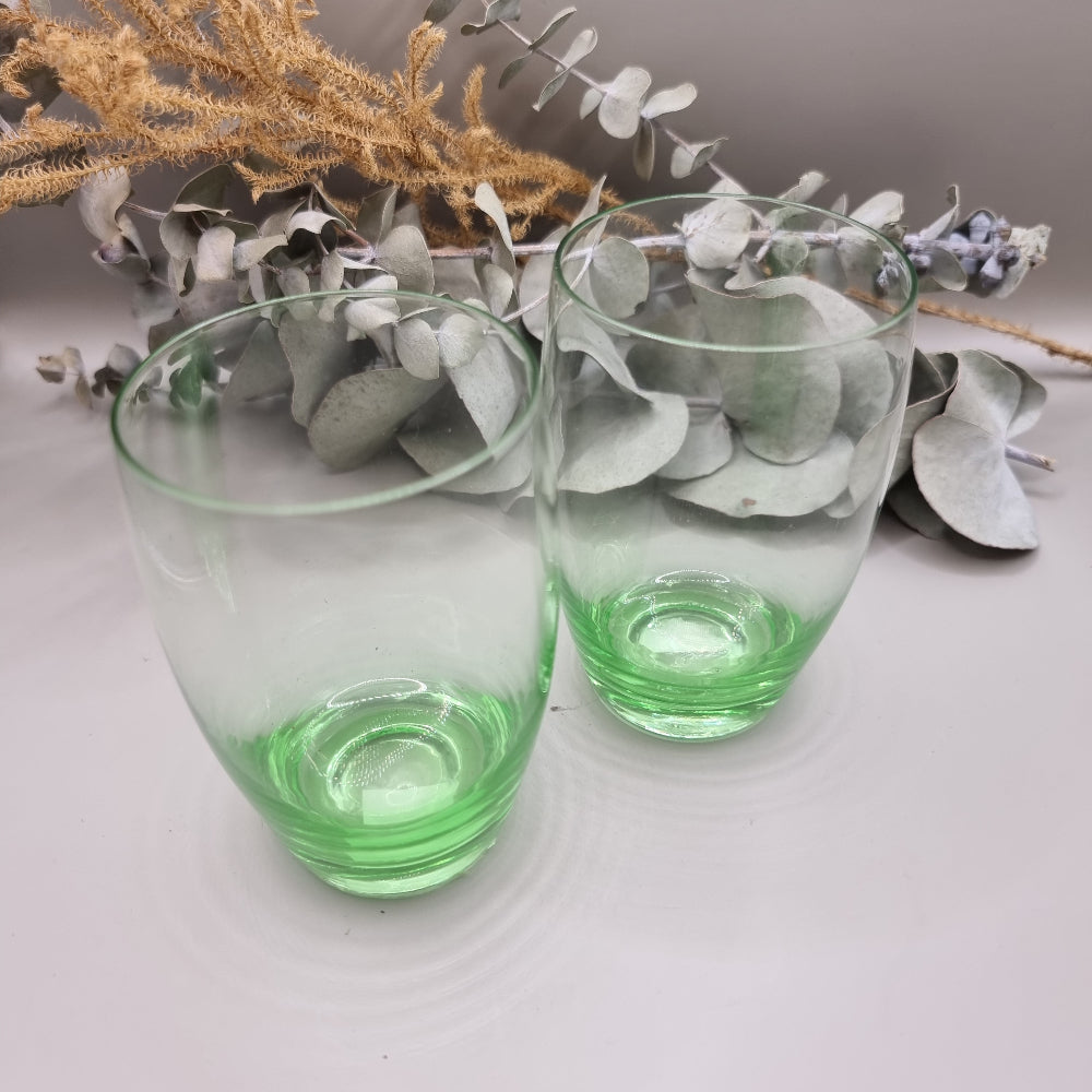 Pair of vintage green glass tumblers with rounded shape and green tint