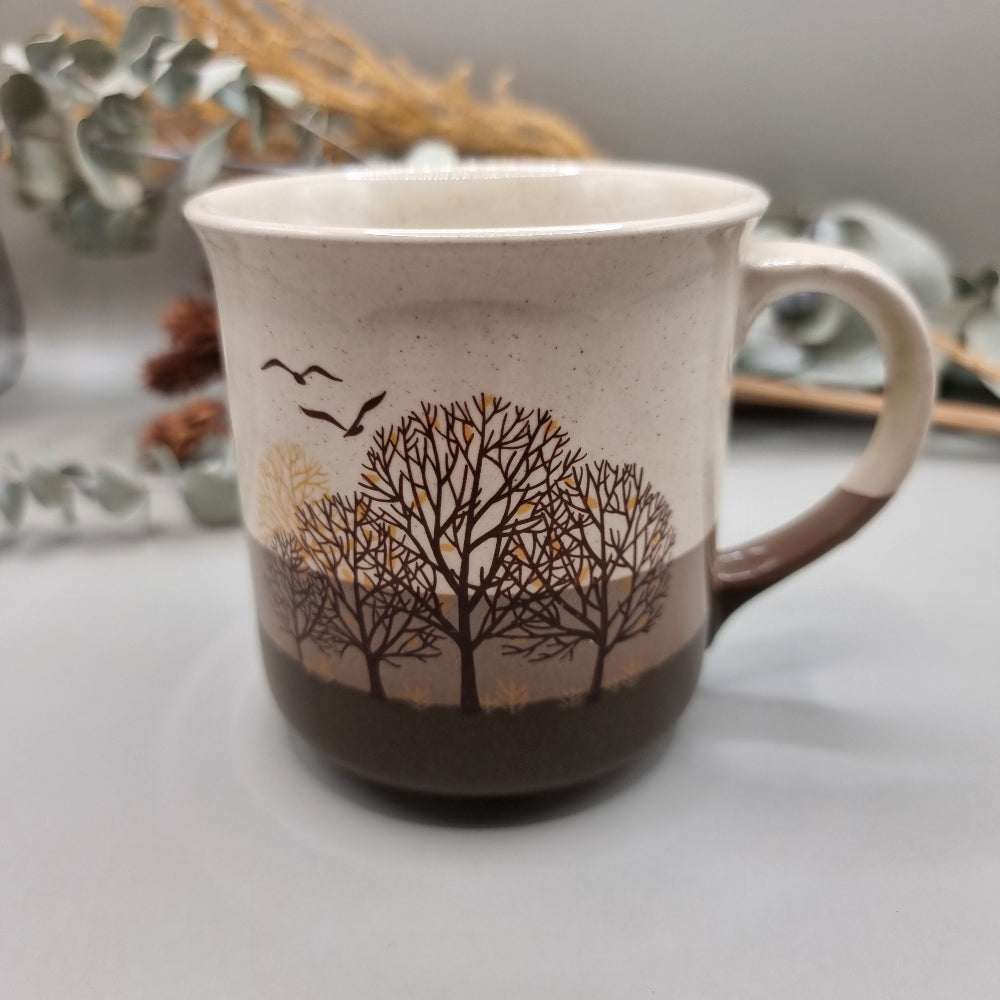 Vintage mug with trees and birds design