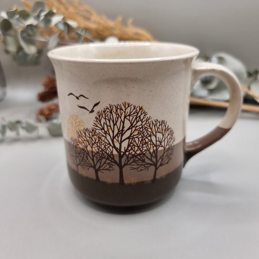 Vintage mug with trees and birds design