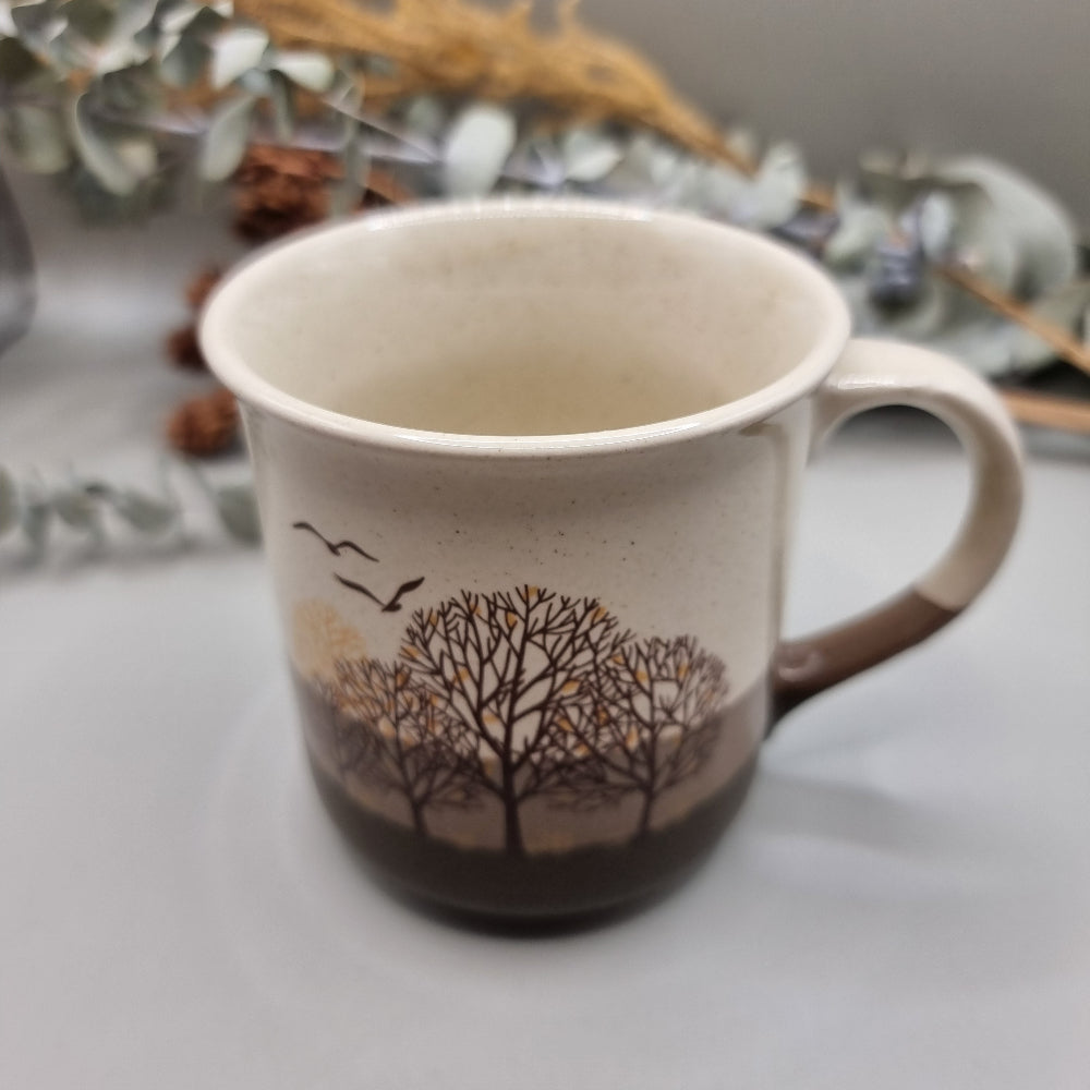 Vintage mug with trees and birds design