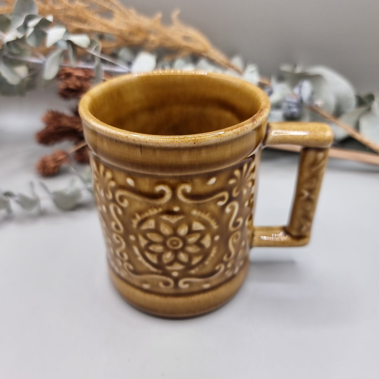 Vintage mug with floral pattern