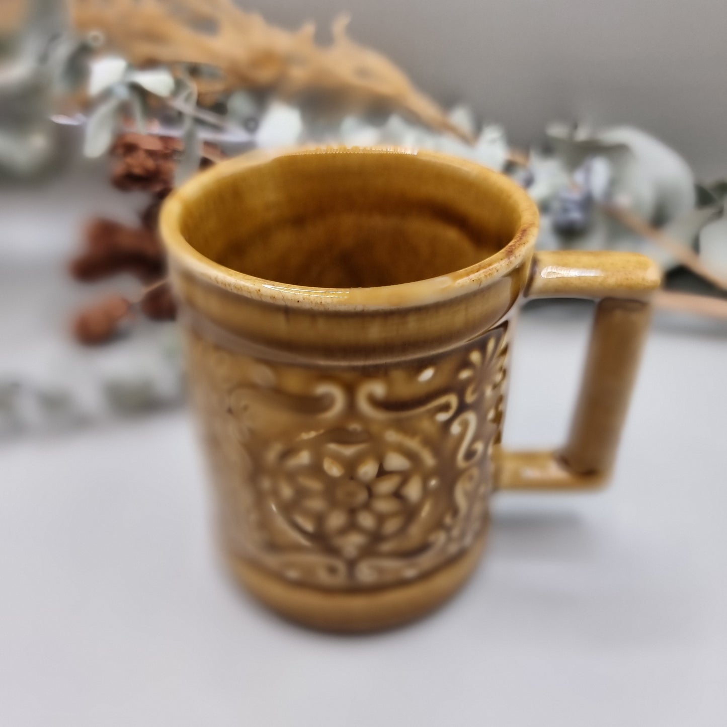 Vintage mug with floral pattern
