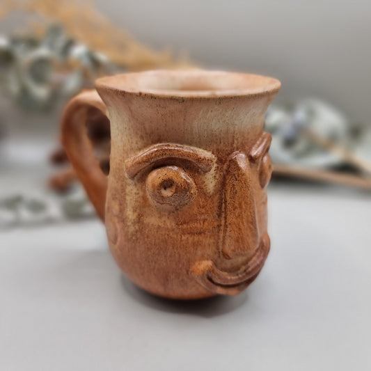 Vintage art pottery 'ugly face' design