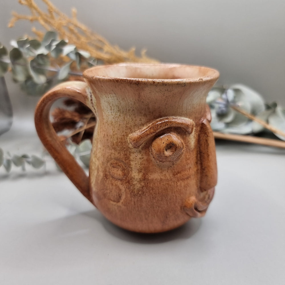 Vintage art pottery 'ugly face' design