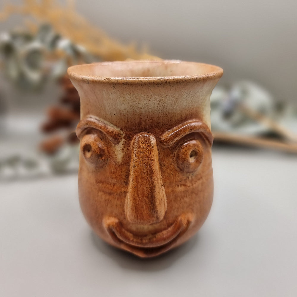 Vintage art pottery 'ugly face' design