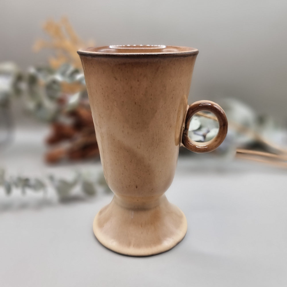 Tall ceramic pedestal footed mug