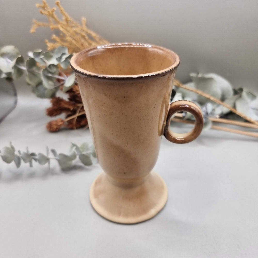 Tall ceramic pedestal footed mug