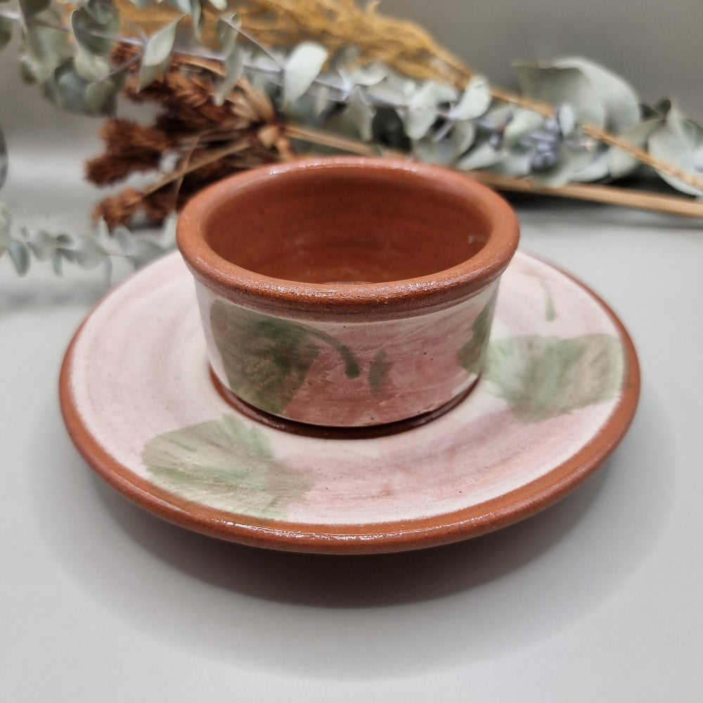 Terracotta serving dish with plate