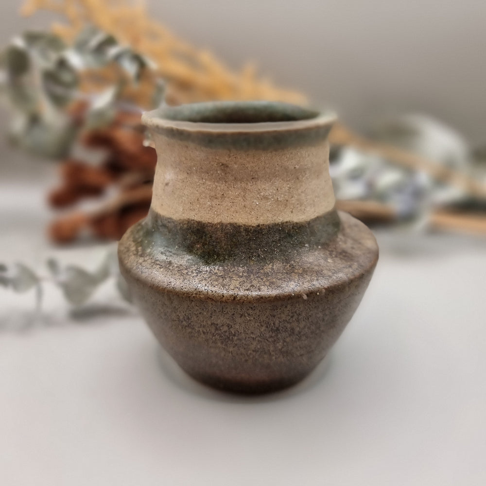 Studio pottery vase in earth tones