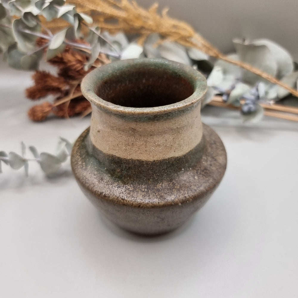 Studio pottery vase in earth tones