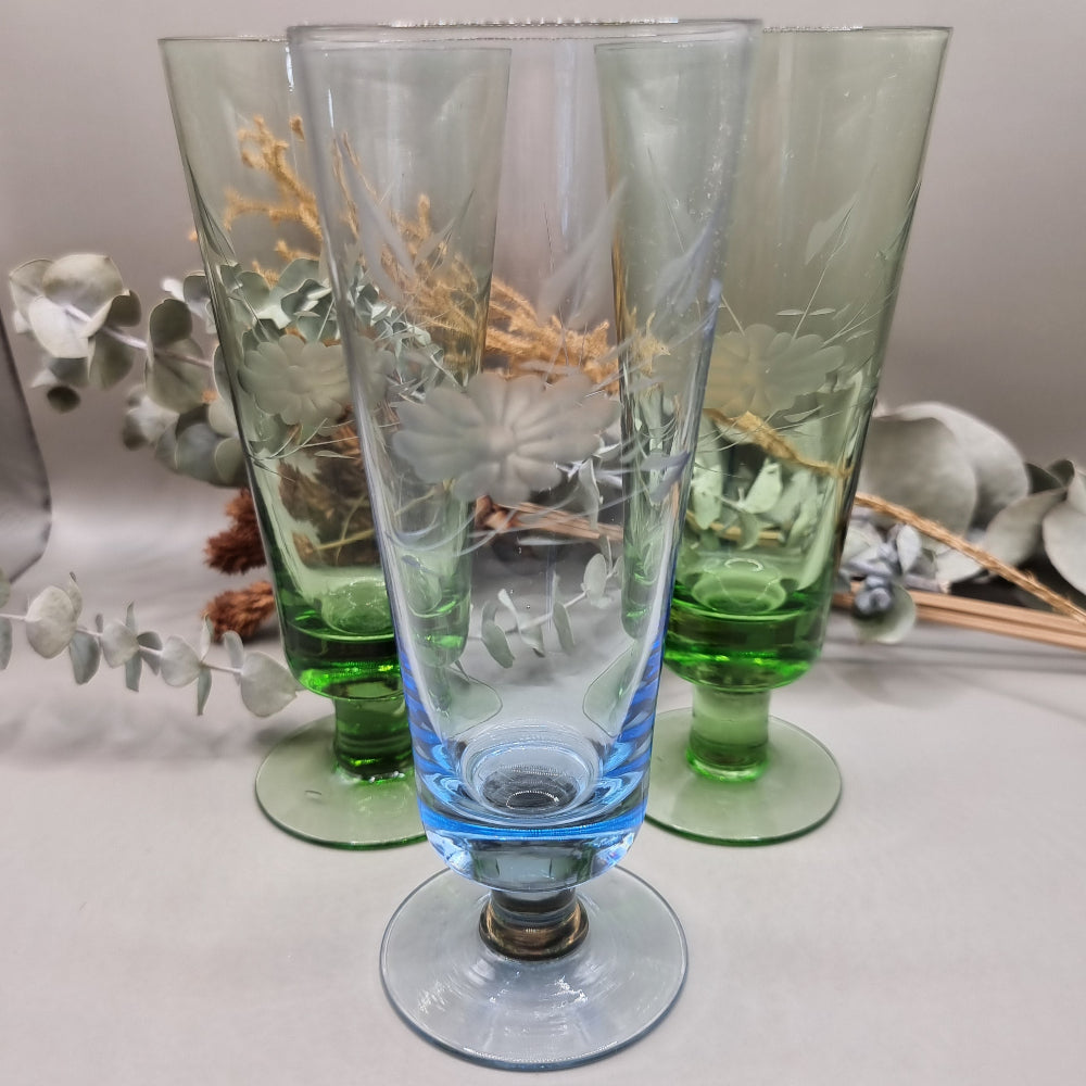 Set of 3 etched glass goblets in green and blue with floral design.
