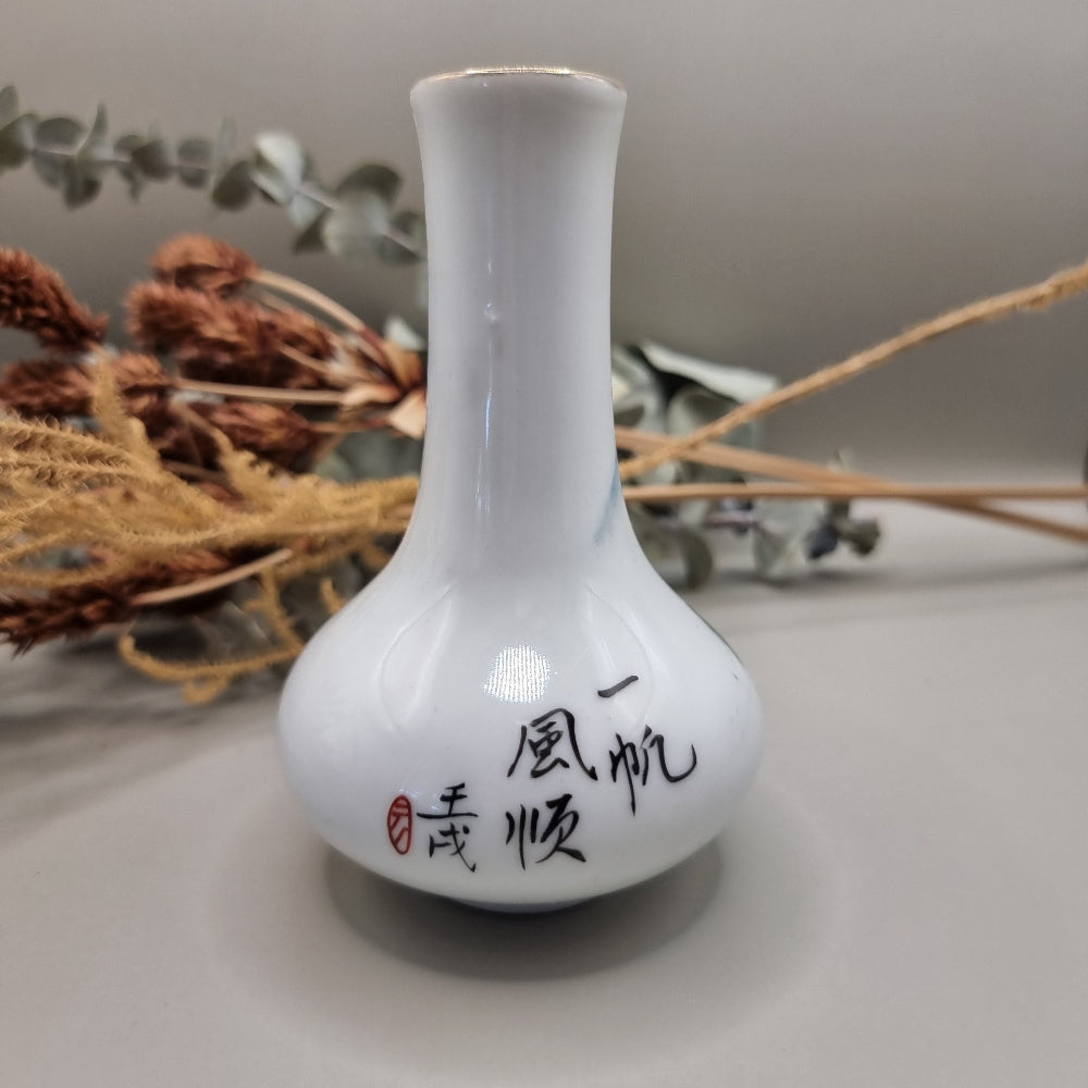 Hand-painted Chinese porcelain bud vase with mountain scene and calligraphy.