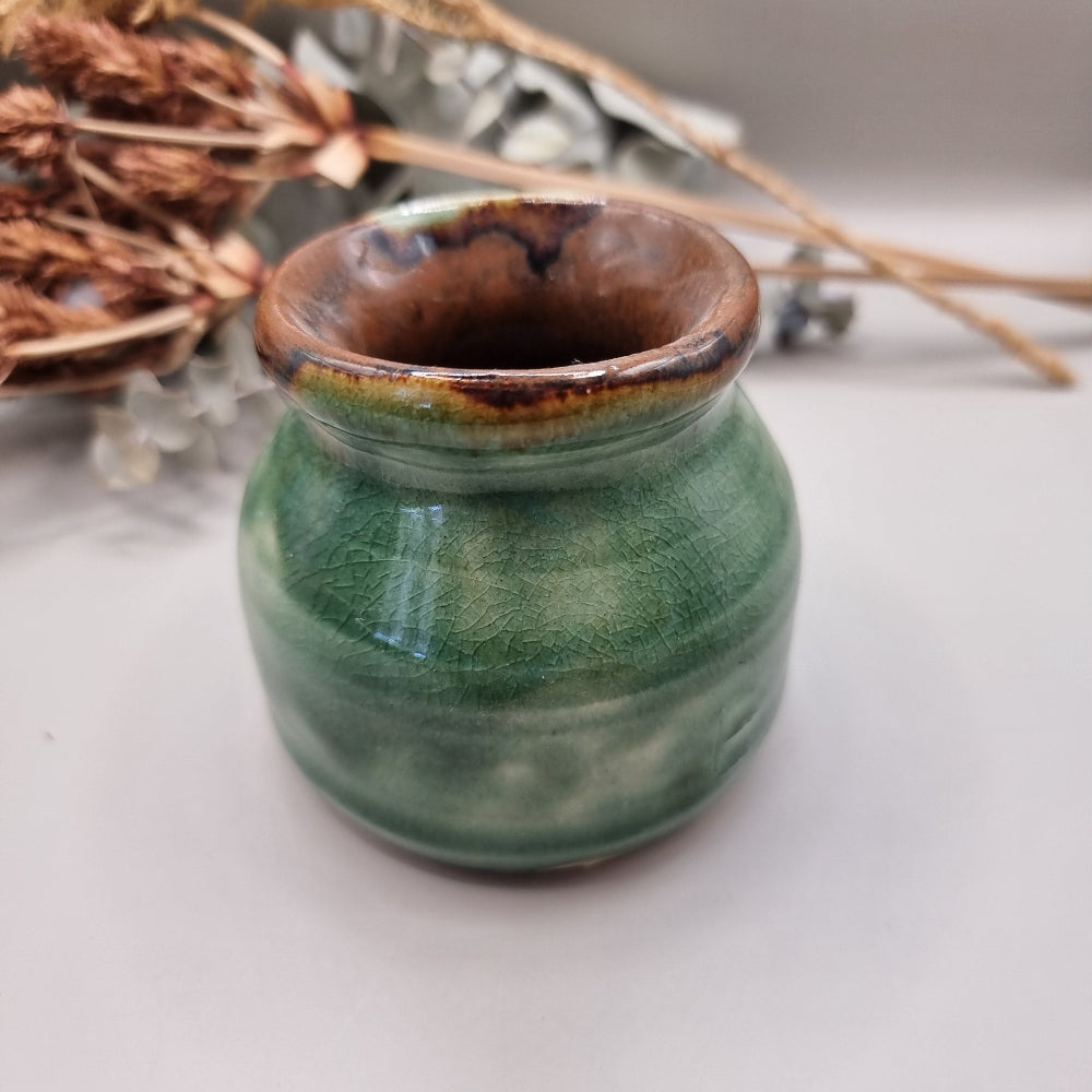 Handmade green pottery pot with crackle glaze and brown rim
