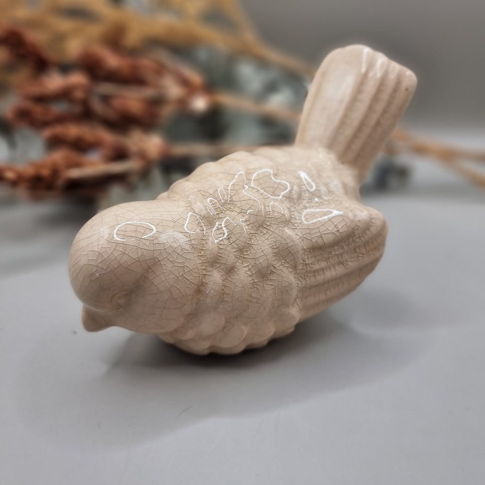 Cream ceramic bird figurine with crackle glaze finish