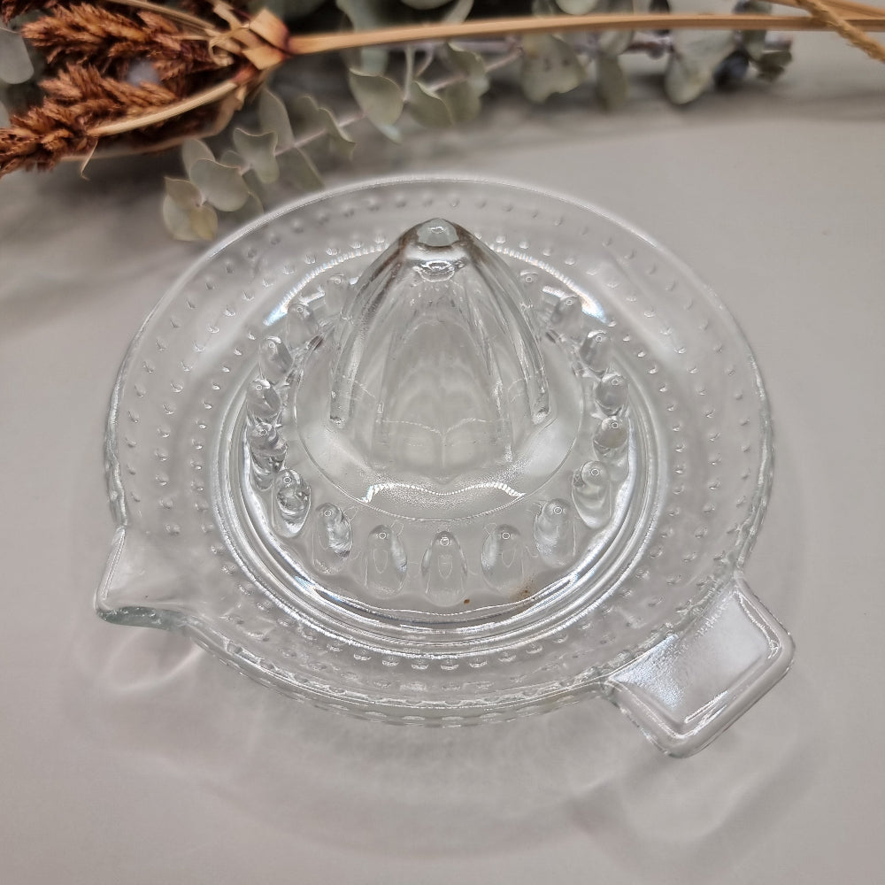 Vintage clear glass citrus juicer with spout and seed catcher