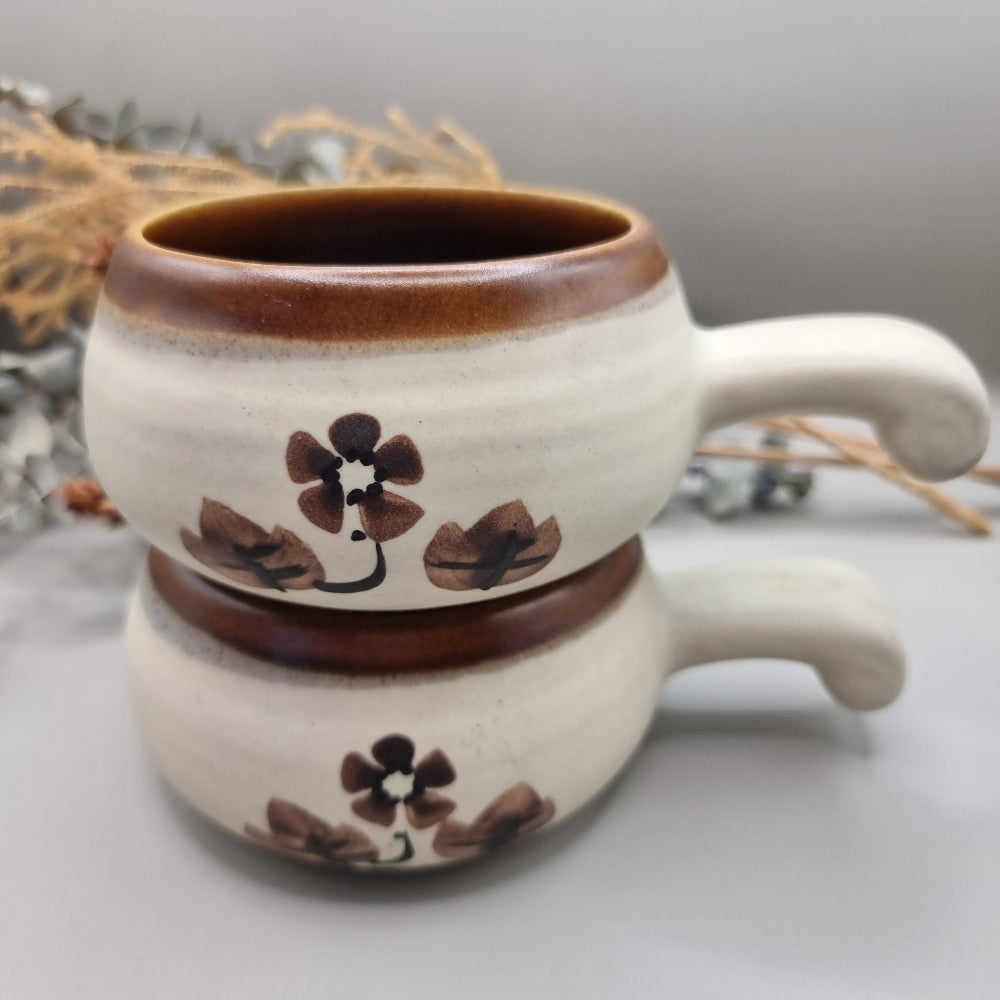 Set of 4 vintage soup bowls with brown rims and floral design.