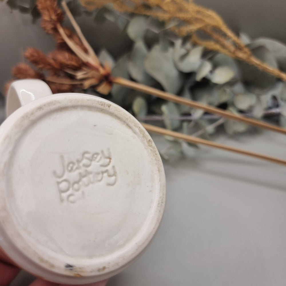 Jersey Pottery vintage mug with hand-painted brown floral design and white glaze