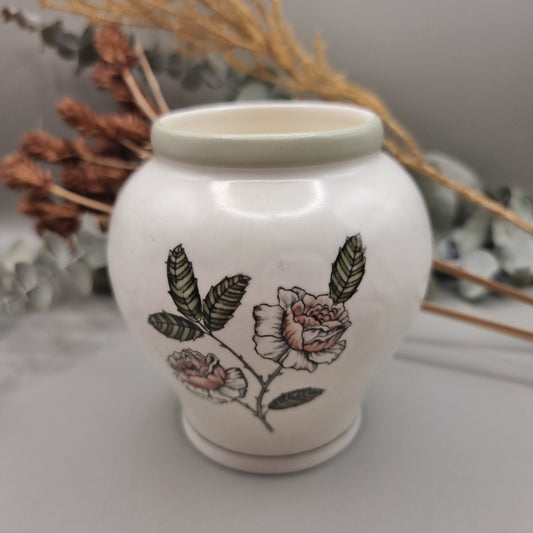 Crown Devon Fieldings vase 1244 with floral and leaf design on creamy ceramic base.